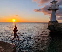 The Negril coastline at sunset beside the oceanfront cliffs of the Afterlight setting in Jamaica